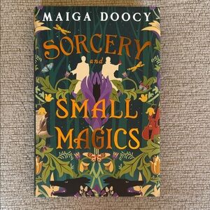 Maiga Doocy's Sorcery and Small Magics Book with Green and Orange Cover